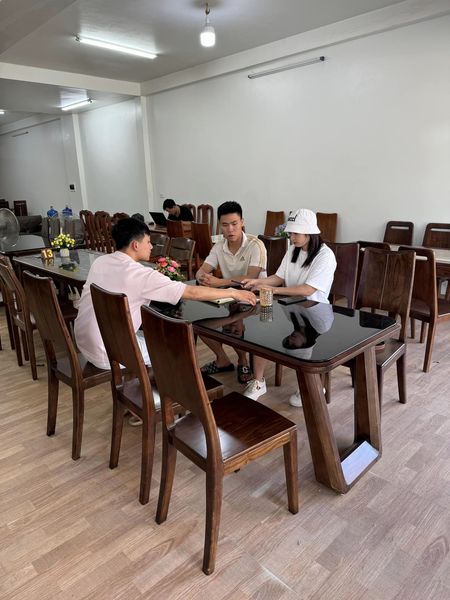 Bộ bàn ăn 8 ghế bọc đệm da chân quỳ nguyên khối